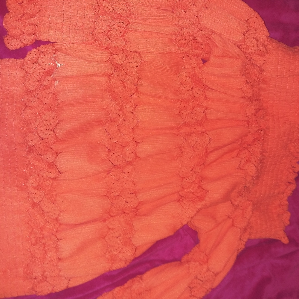 A coral off the shoulder top.